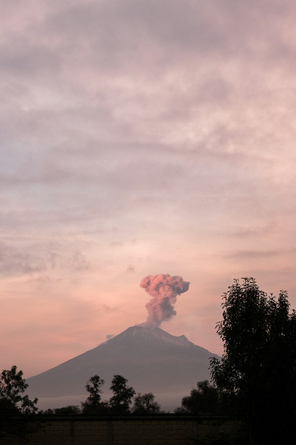 black mountain under white clouds during daytime