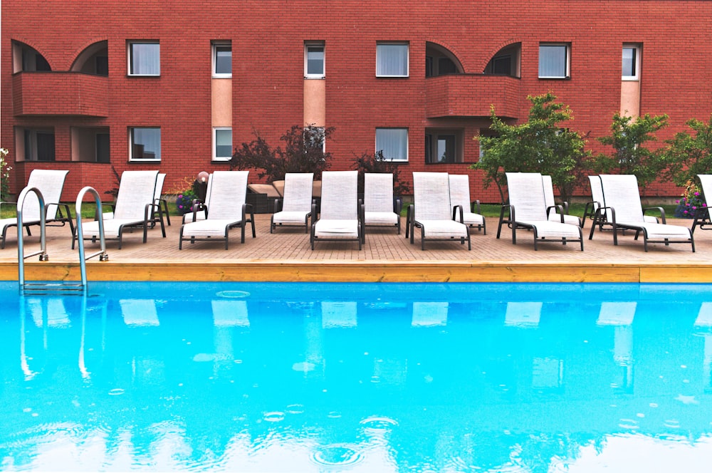 brown concrete building near swimming pool during daytime