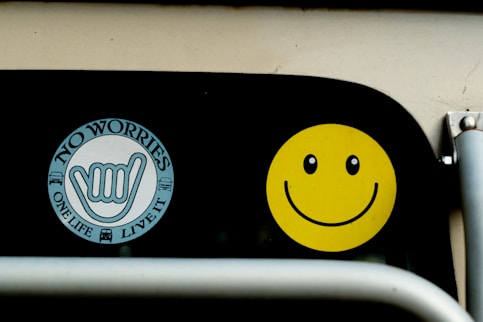 a close up of a traffic light with a smiley face