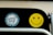 a close up of a traffic light with a smiley face