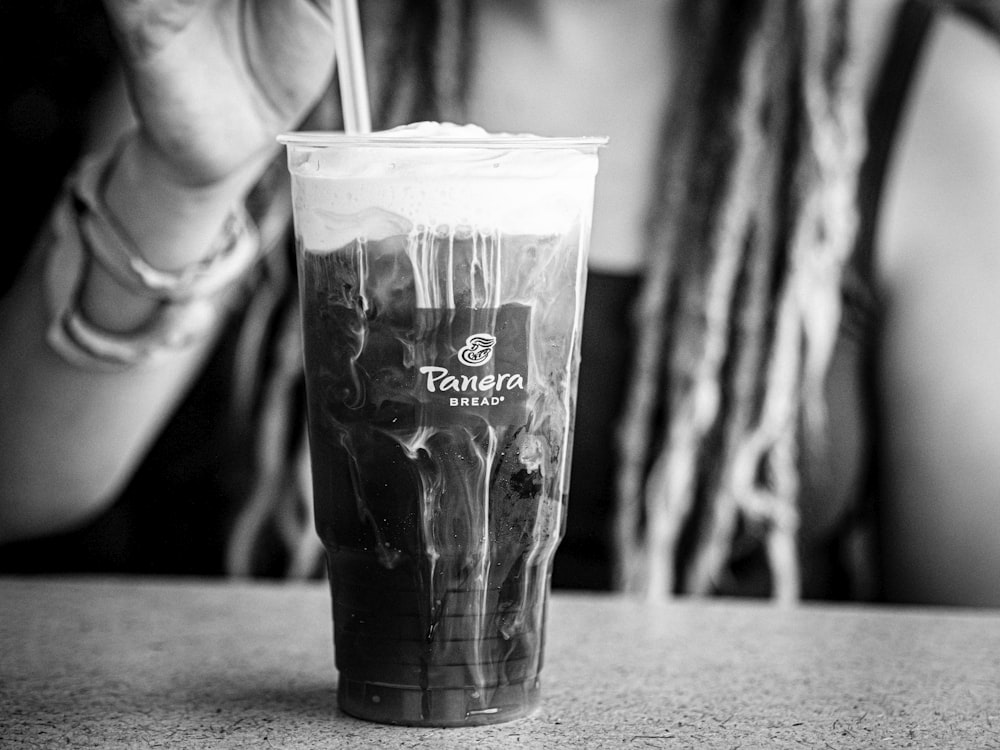 grayscale photo of clear drinking glass