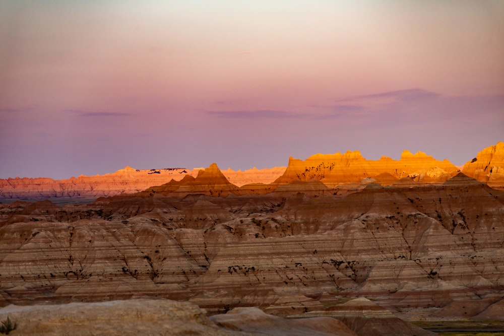 brown rocky mountain during sunset