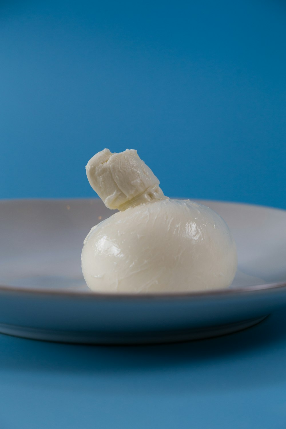 white egg on white ceramic plate