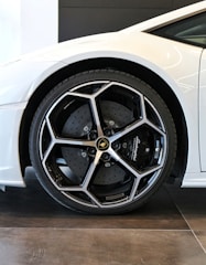 white car with chrome wheel