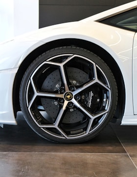 white car with chrome wheel
