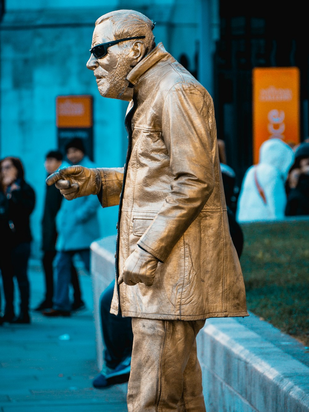 man in brown coat statue