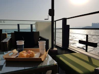 Balcony seating area where guests can relax sipping coffee while watching the sunrise.