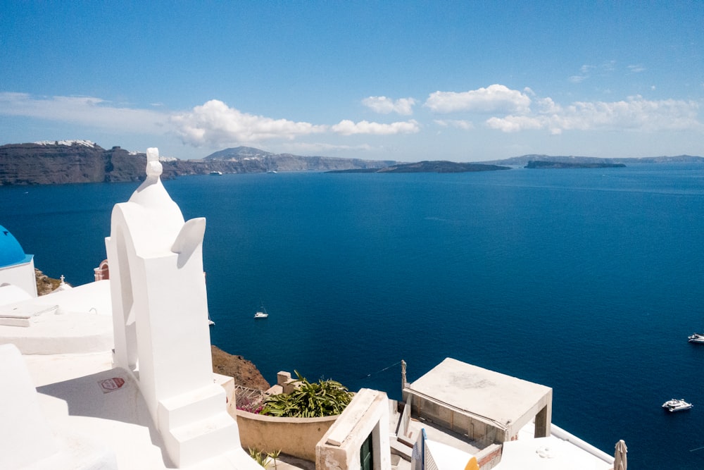 white concrete building near body of water during daytime