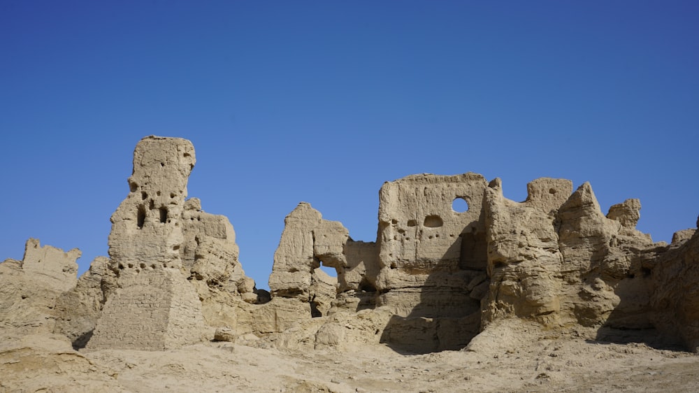 brown rock formation under blue sky during daytime