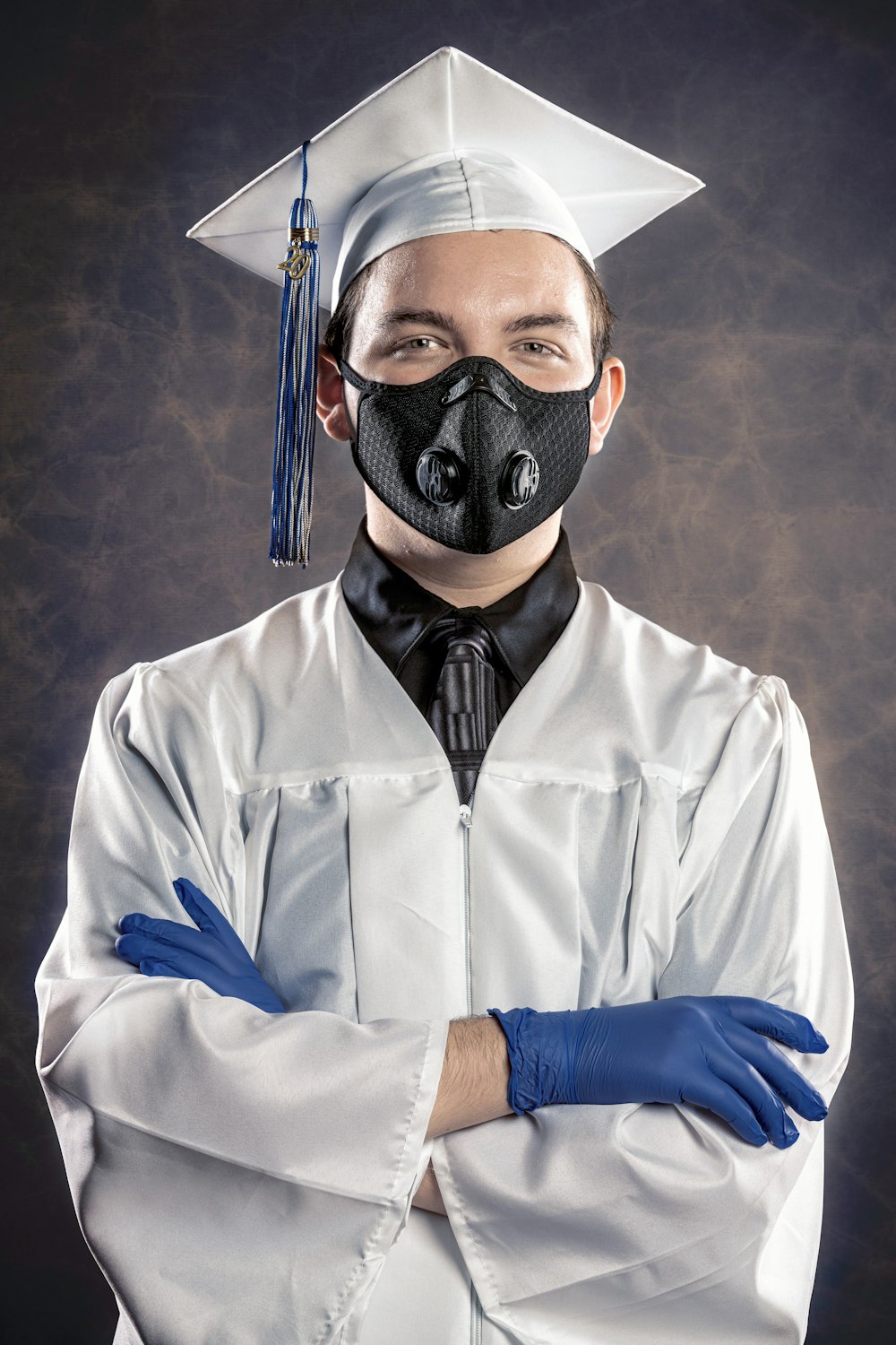 man in white button up shirt wearing black mask