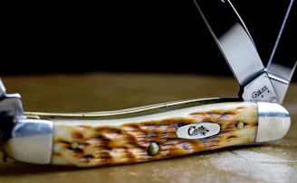 a close up of a pair of scissors on a table