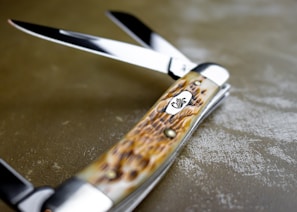 a close up of a pair of scissors on a table