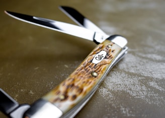 a close up of a pair of scissors on a table