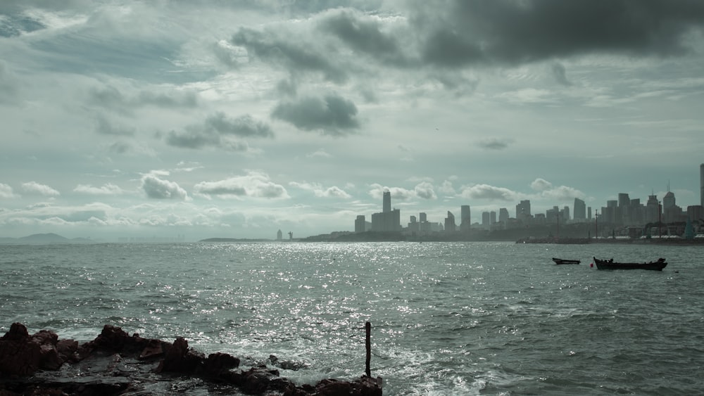 body of water under cloudy sky during daytime