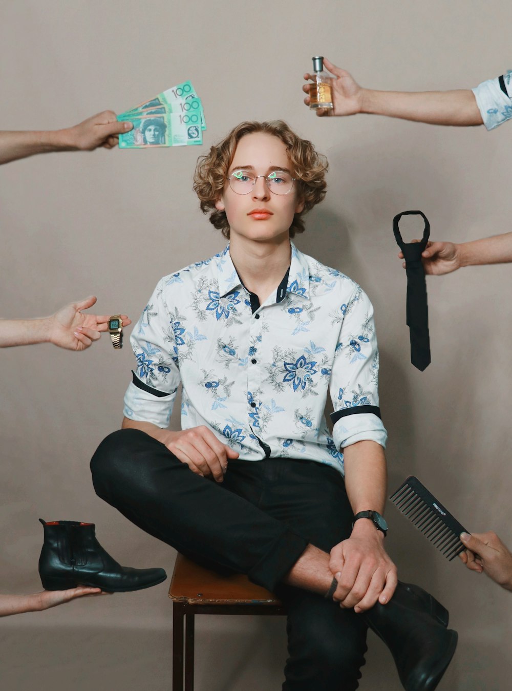 woman in white and black floral button up shirt sitting beside woman in black pants