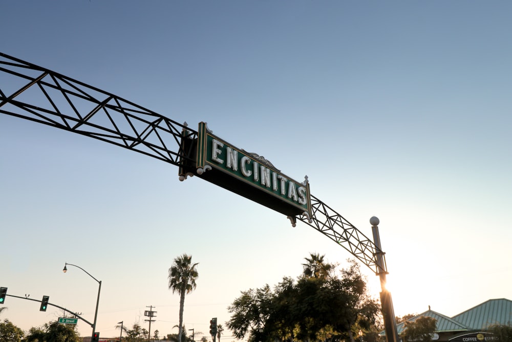 a street sign hanging from the side of a metal structure