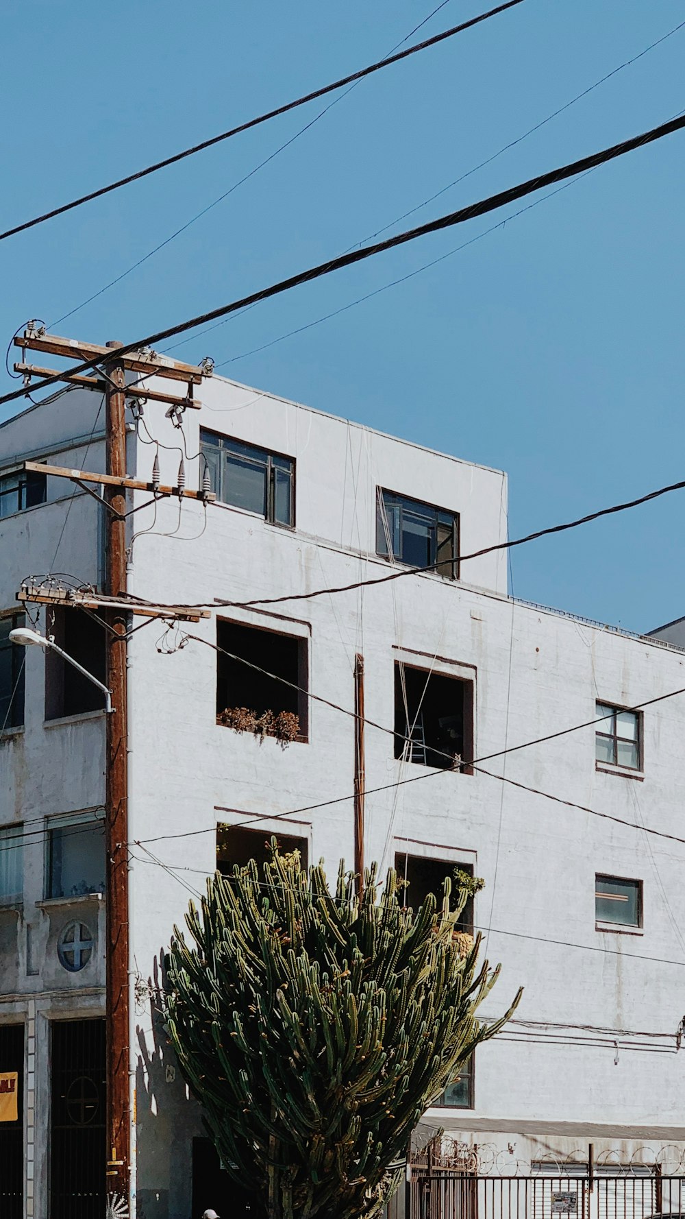 white concrete building under blue sky during daytime