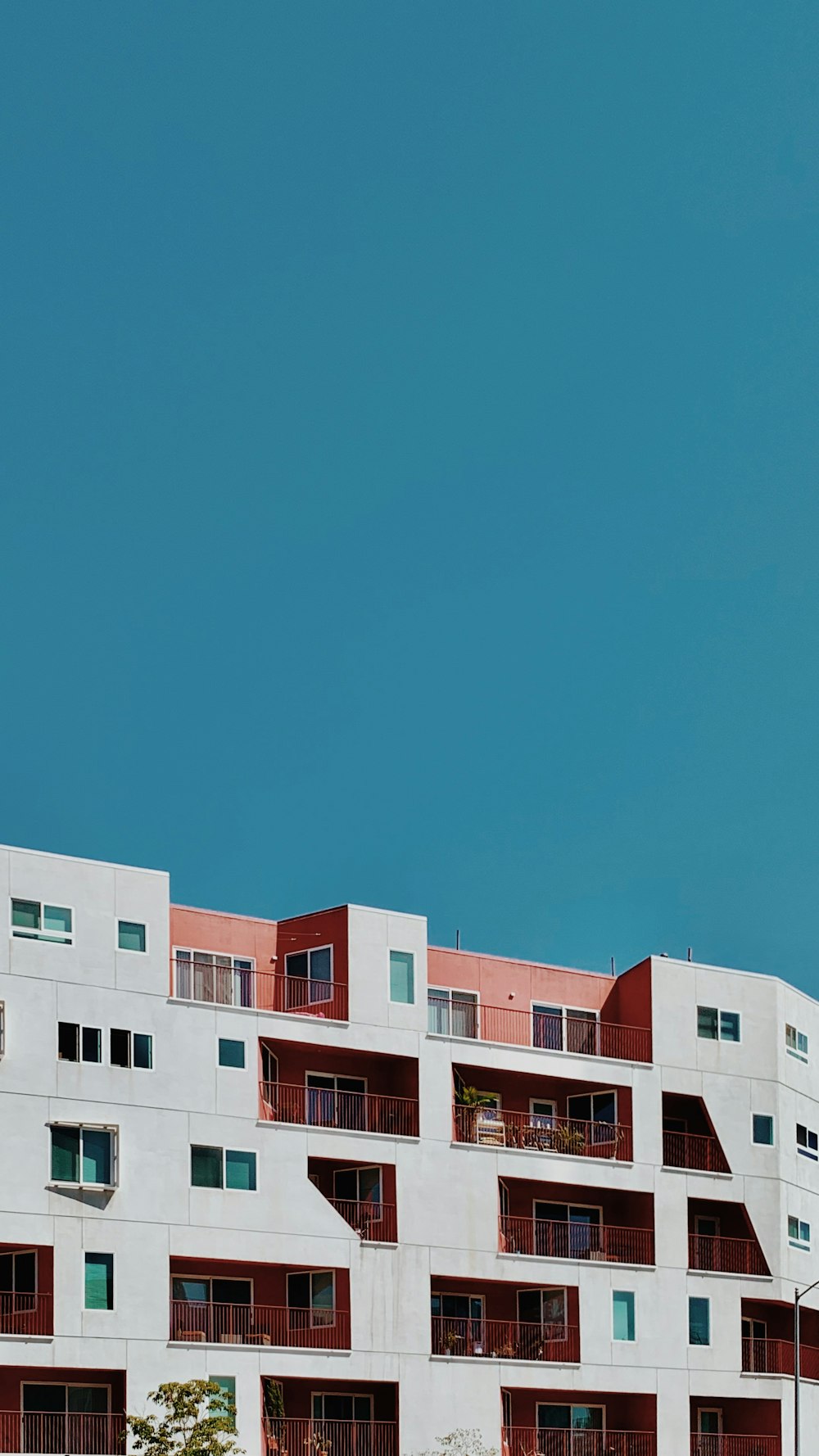 white and brown concrete building under blue sky during daytime