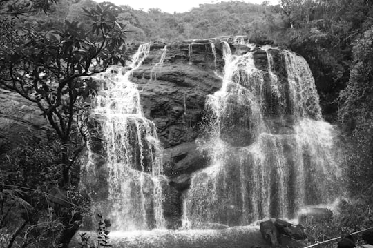 grayscale photo of water falls in Baker's Falls Sri Lanka