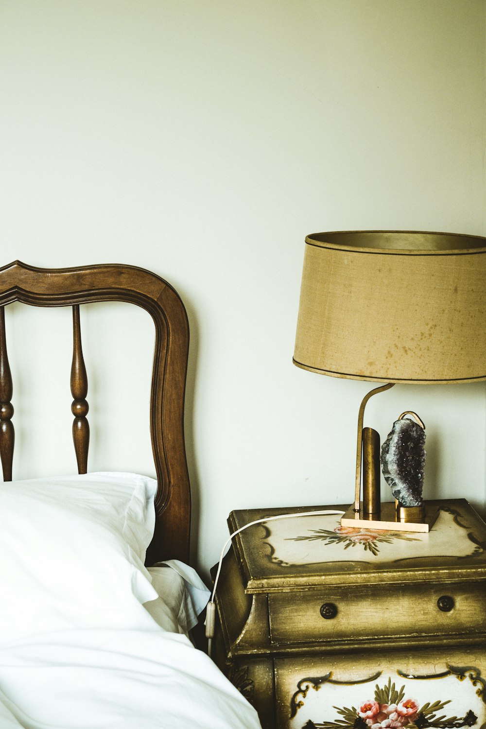 brown wooden framed white shade table lamp on brown wooden table