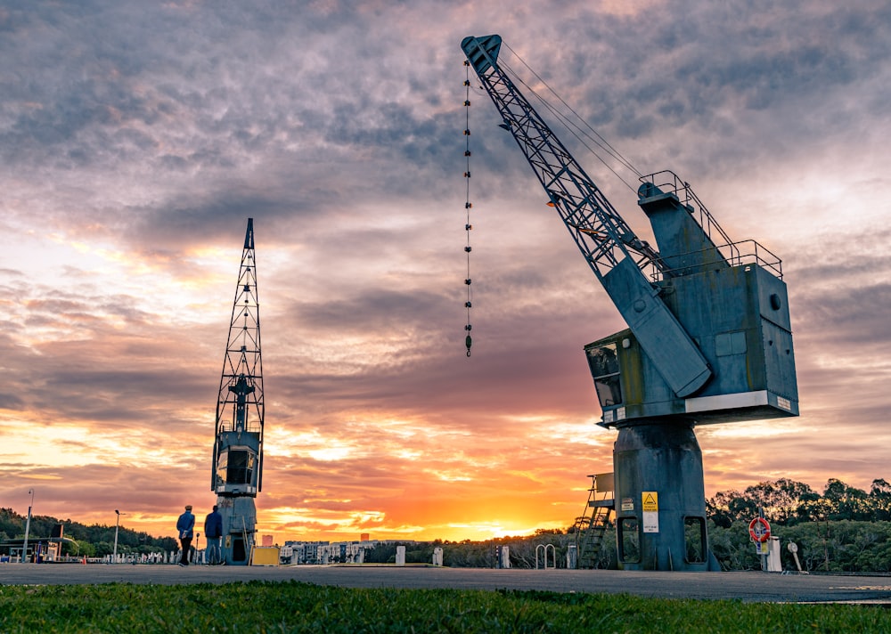 green crane under cloudy sky during daytime