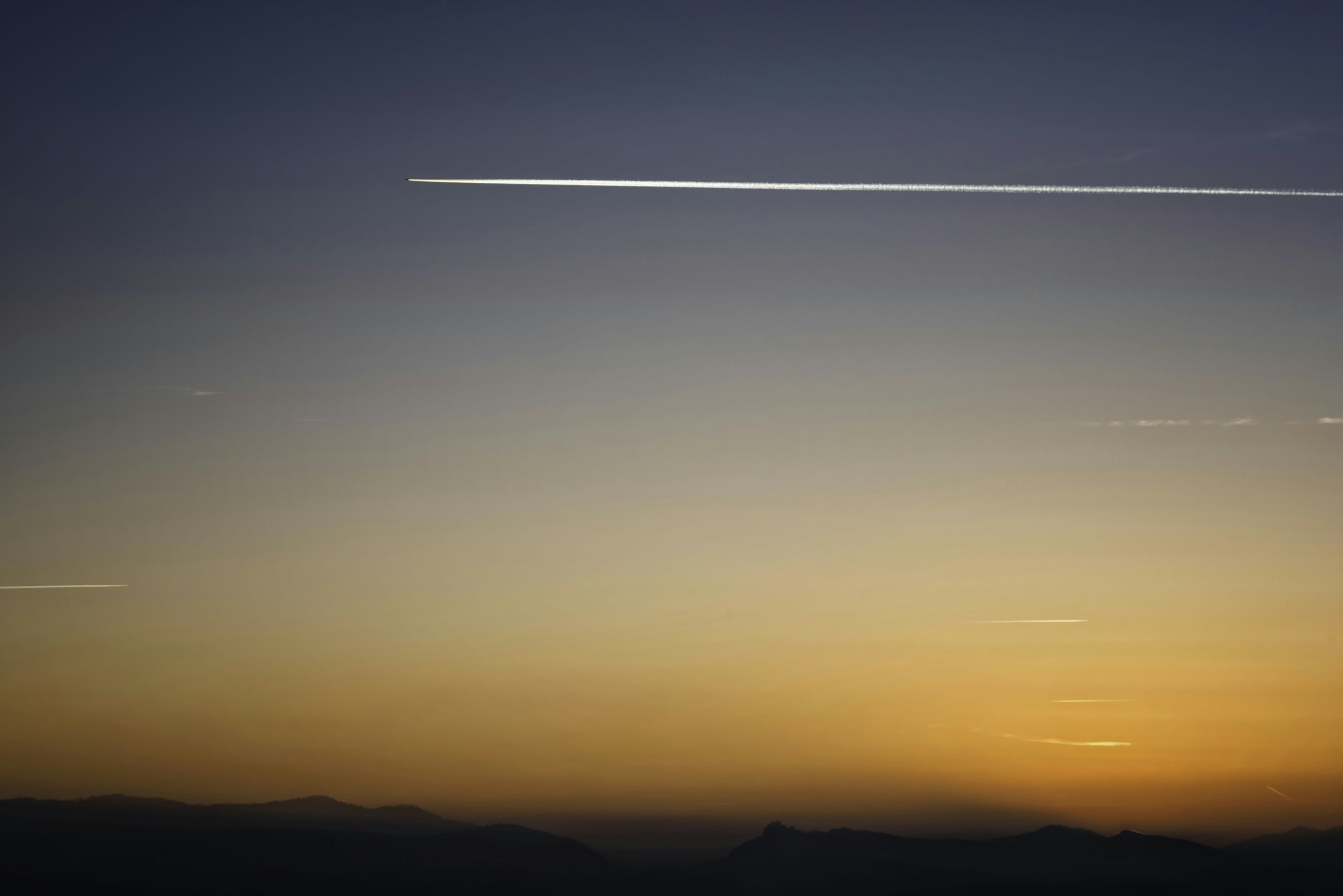 silhouette of mountain during sunset