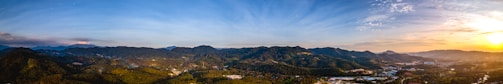 A panoramic view of the smoky mountains bathed in golden sunset light.