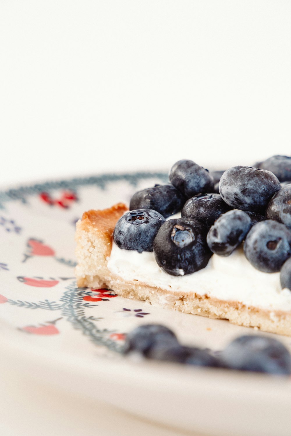 blue berries on white ceramic plate