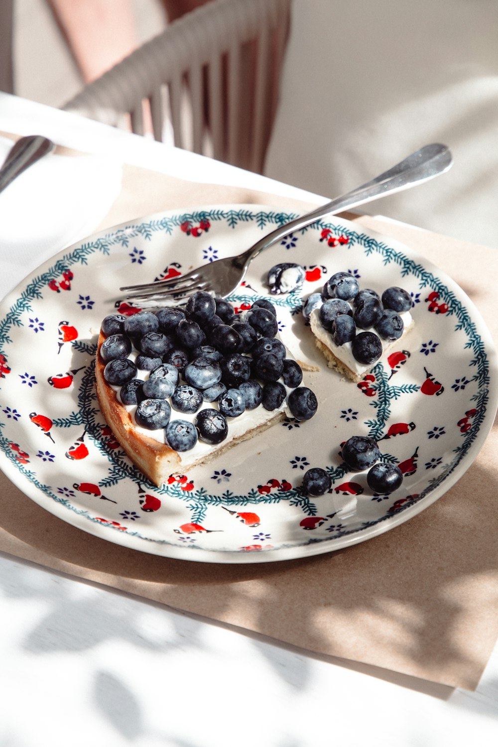 black berries on white ceramic plate