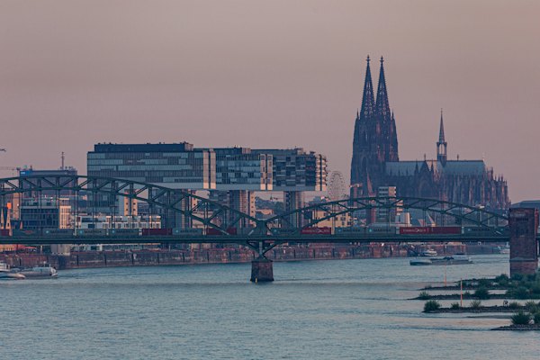 Black and white boat on body of water near bridge during daytime — Cologne, Germany