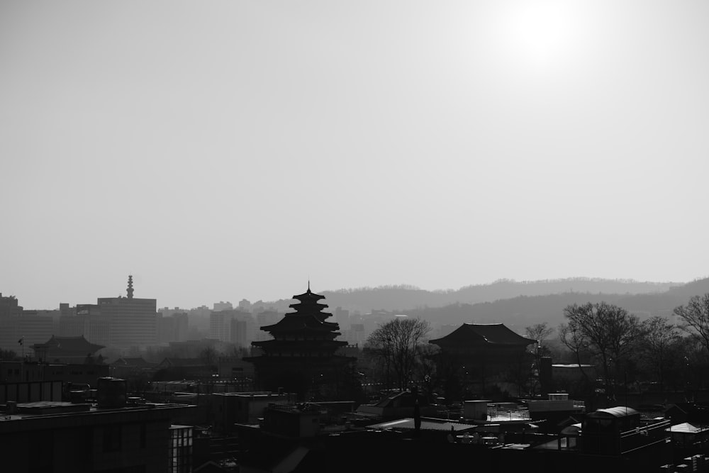 grayscale photo of city buildings