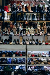 black and white shoes on white shelf