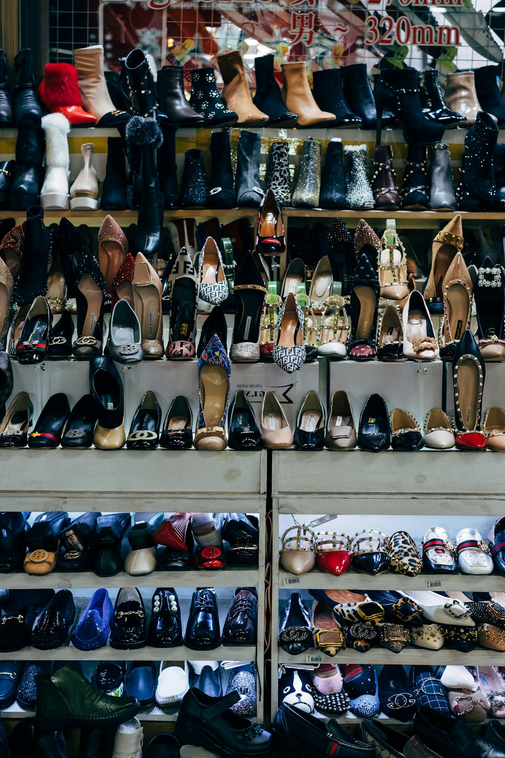 black and white shoes on white shelf