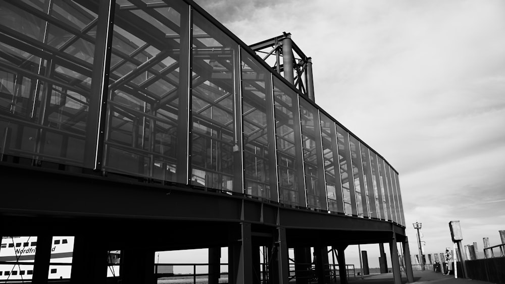 grayscale photo of glass building