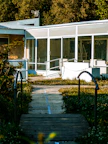 Exterior view of the raumnest building with welcoming entrance and greenery.