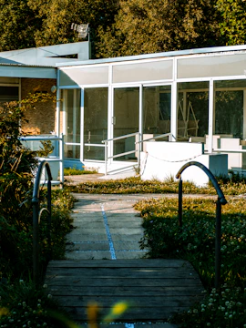 Finished healthcare facility exterior bathed in natural daylight with welcoming entrance.