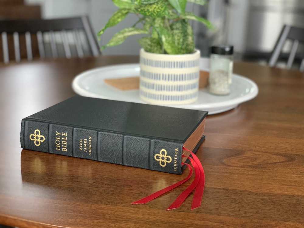 black and red box on brown wooden table