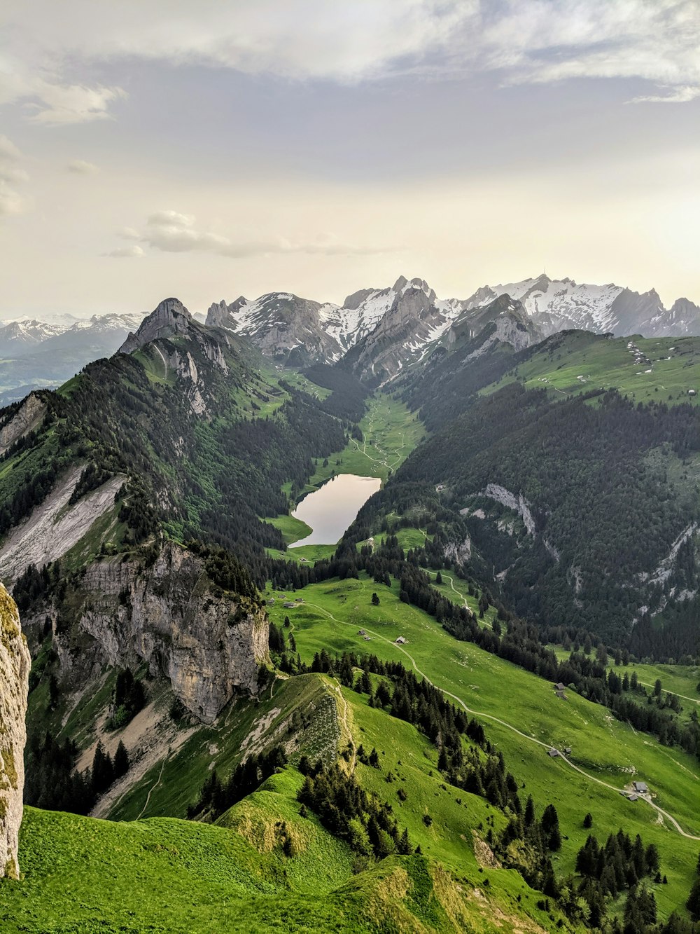 green and gray mountains under white clouds during daytime