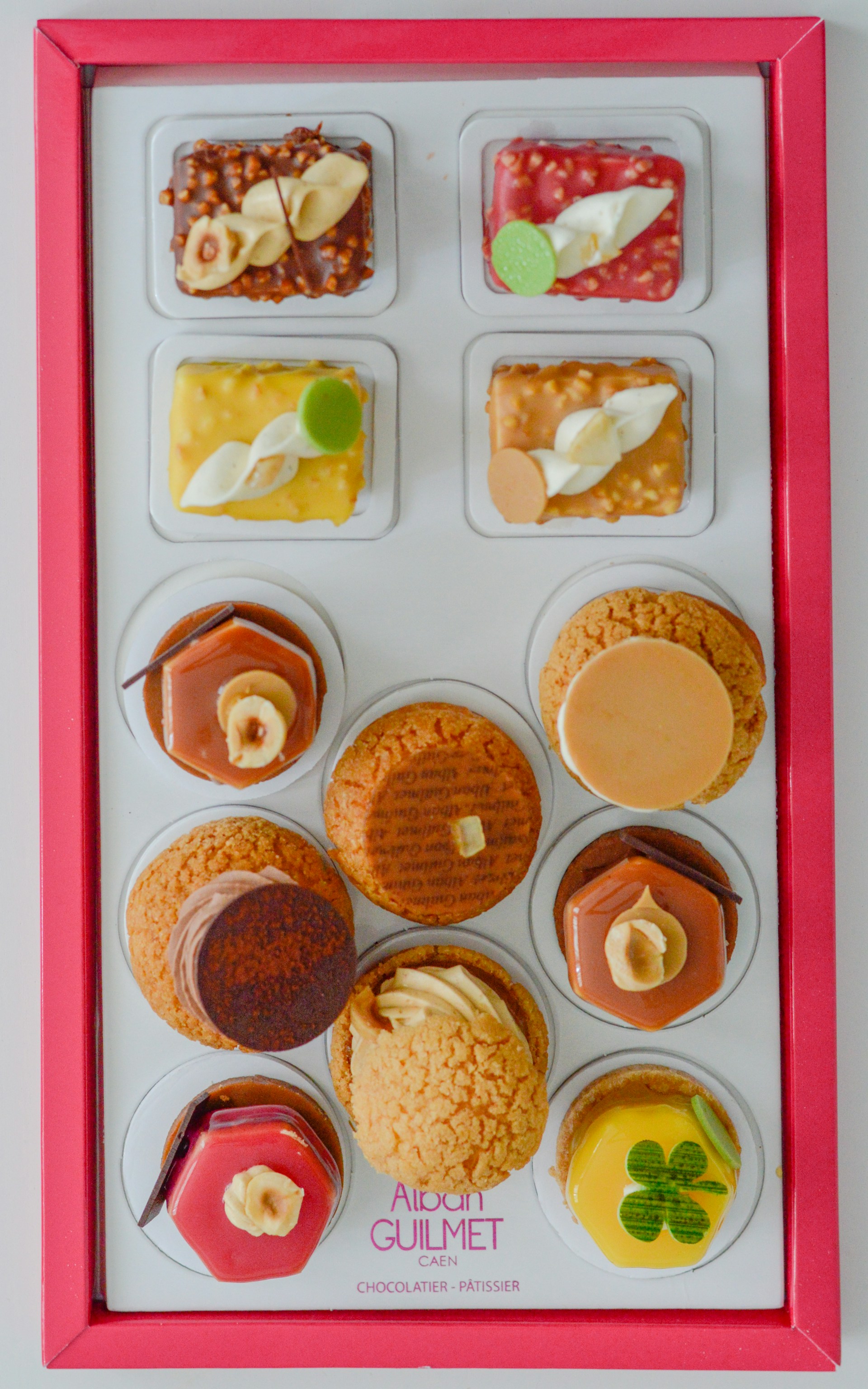 white and pink plastic container