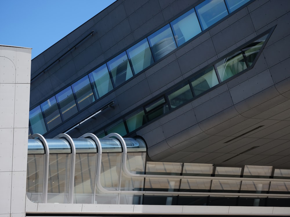 a modern building with a curved roof and windows