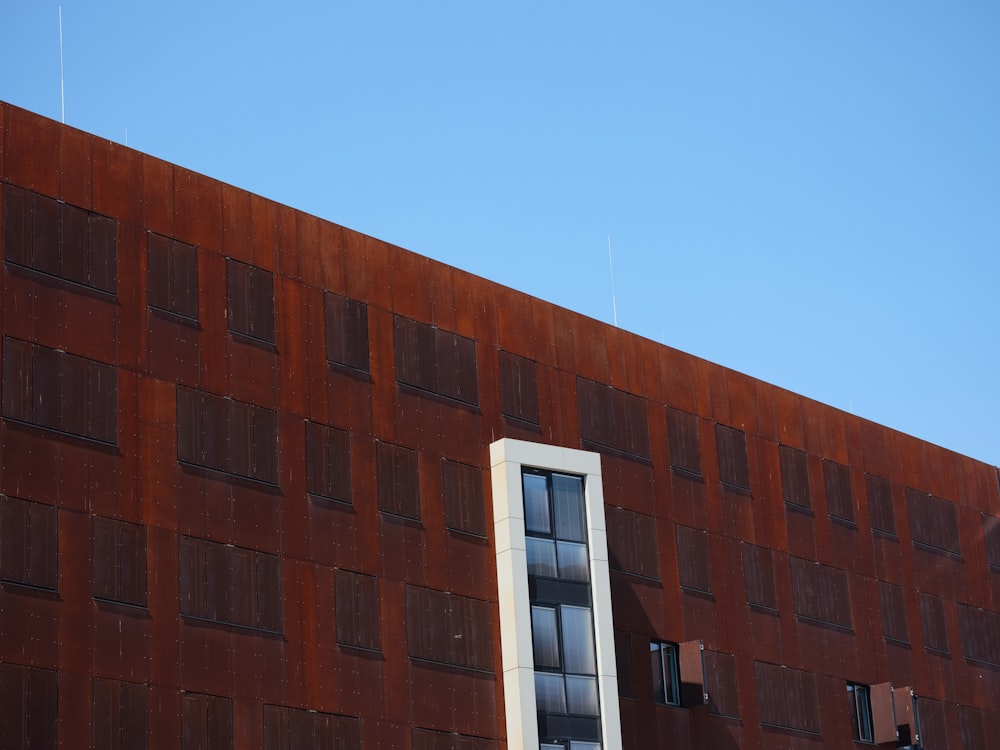 brown concrete building under blue sky during daytime