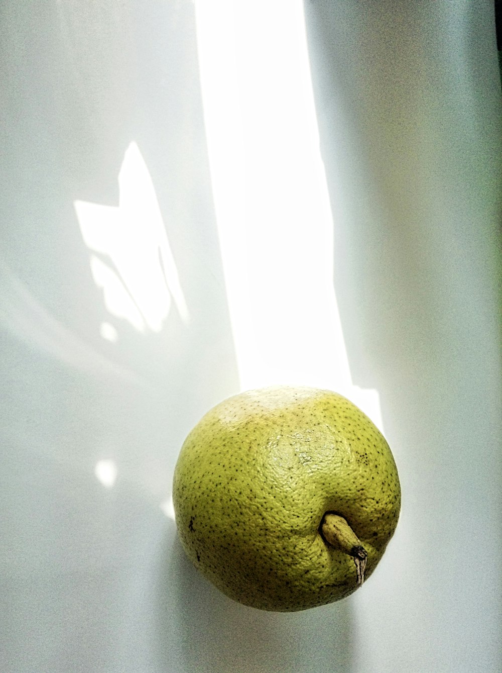 yellow fruit on white table