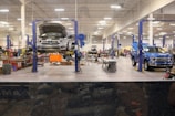 Wide view of the clean and organized service bays inside Saksham Motors.