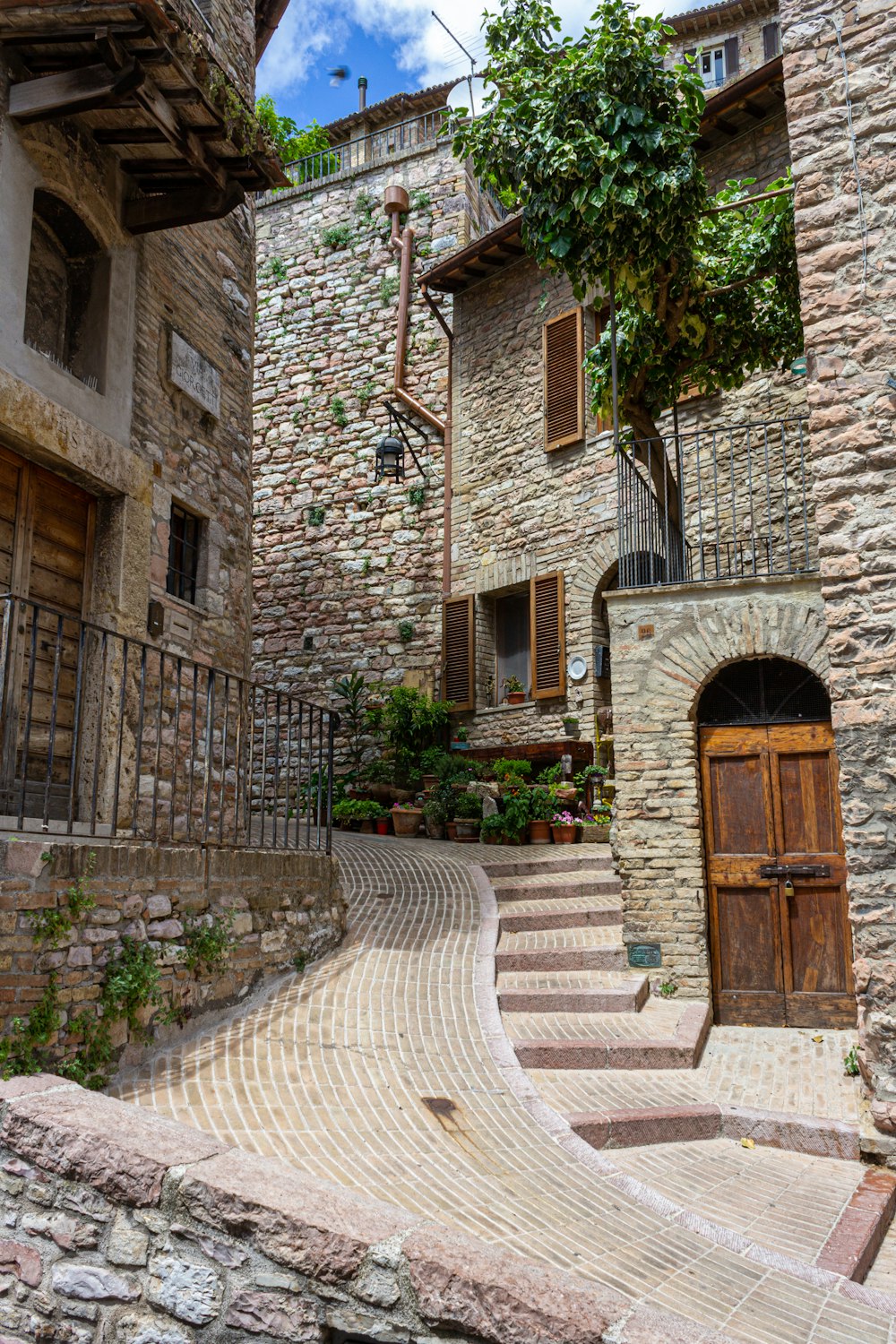 brown wooden door on brown brick building