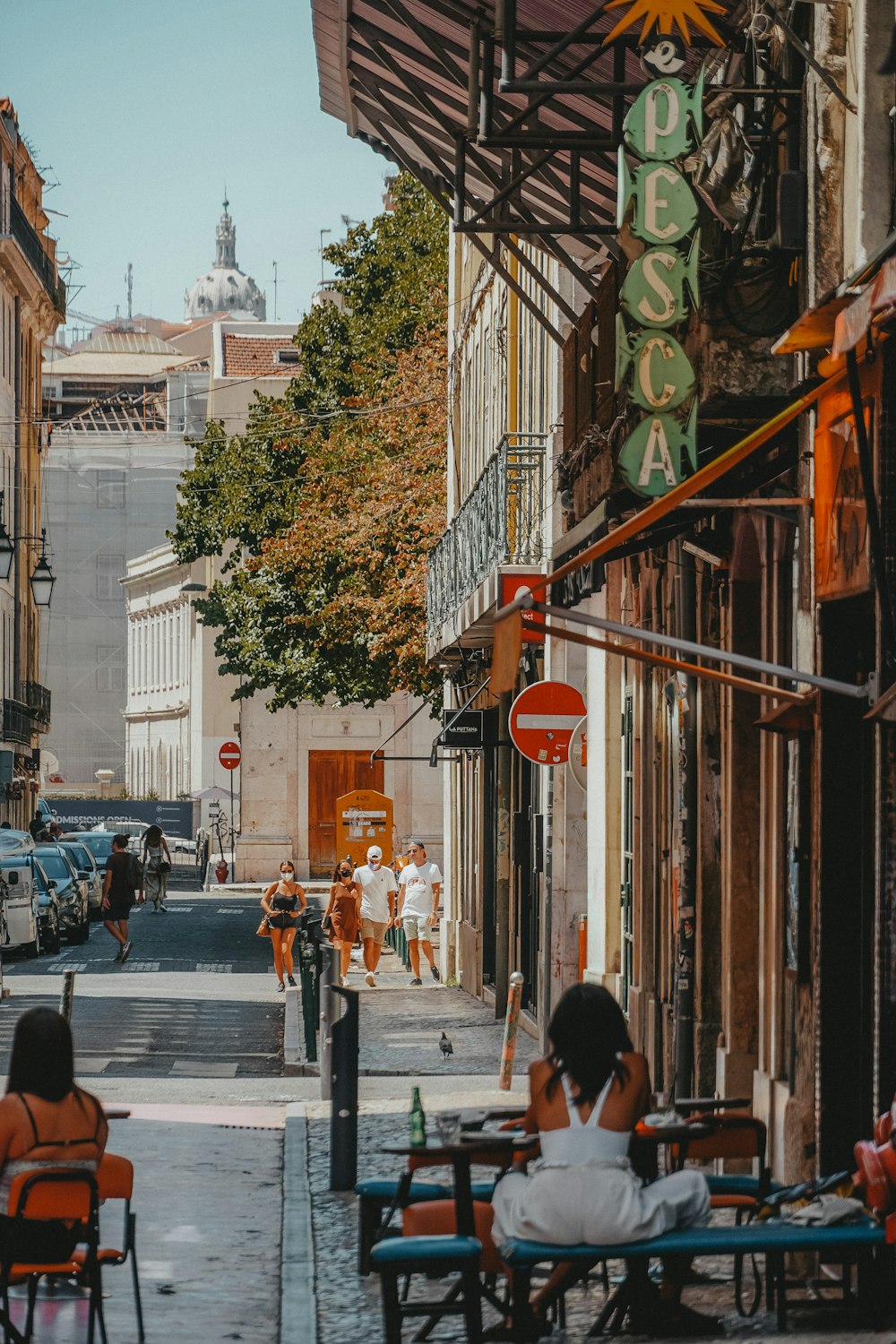 people walking on sidewalk during daytime