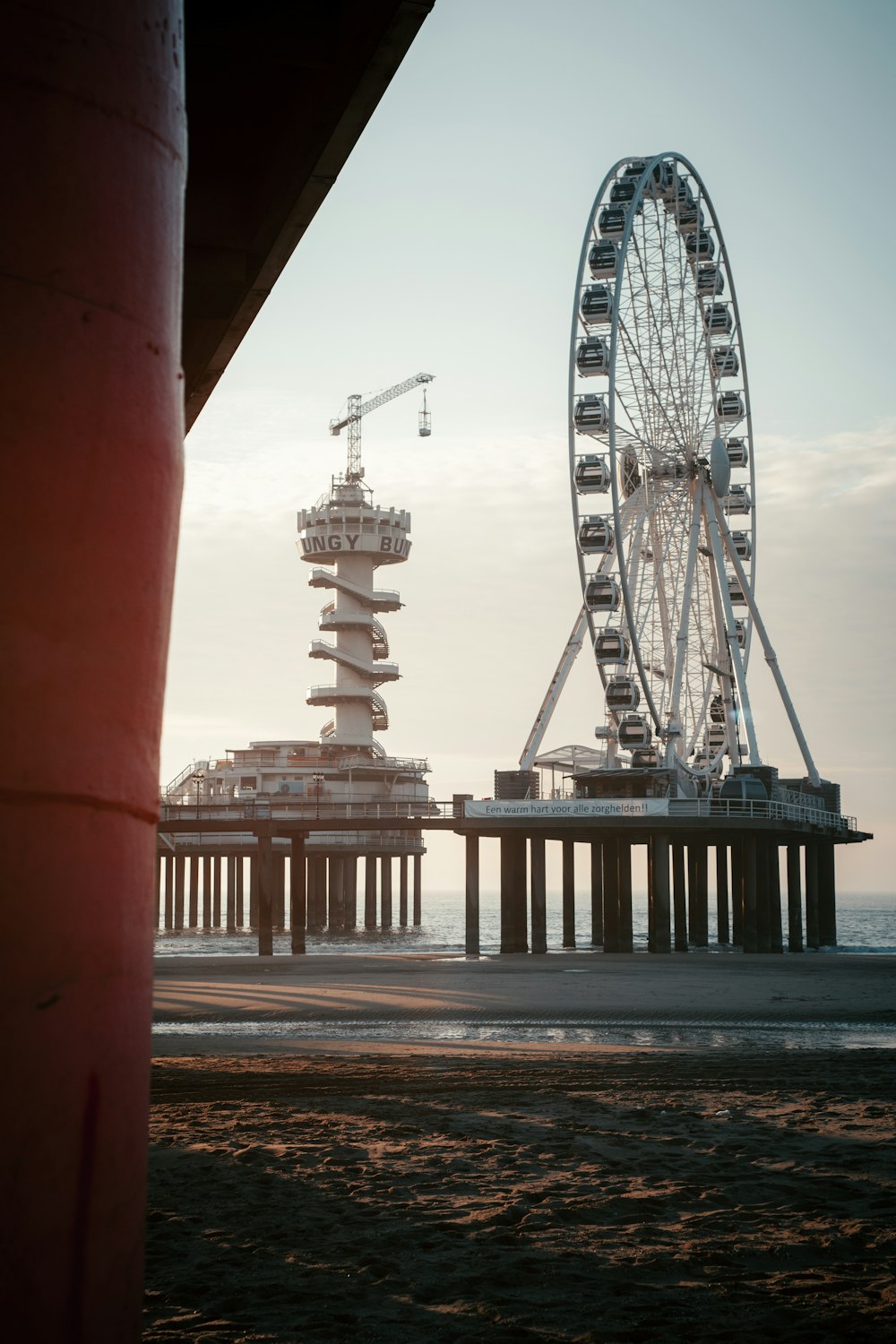 ferris wheel near body of water during daytime