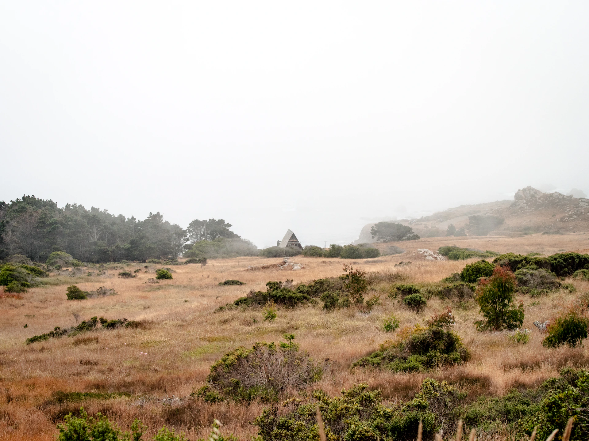 A serene view of the fog-covered landscape in Dhukyachiwadi Gorthan, showcasing the peaceful atmosphere around the NA farmhouse plots.