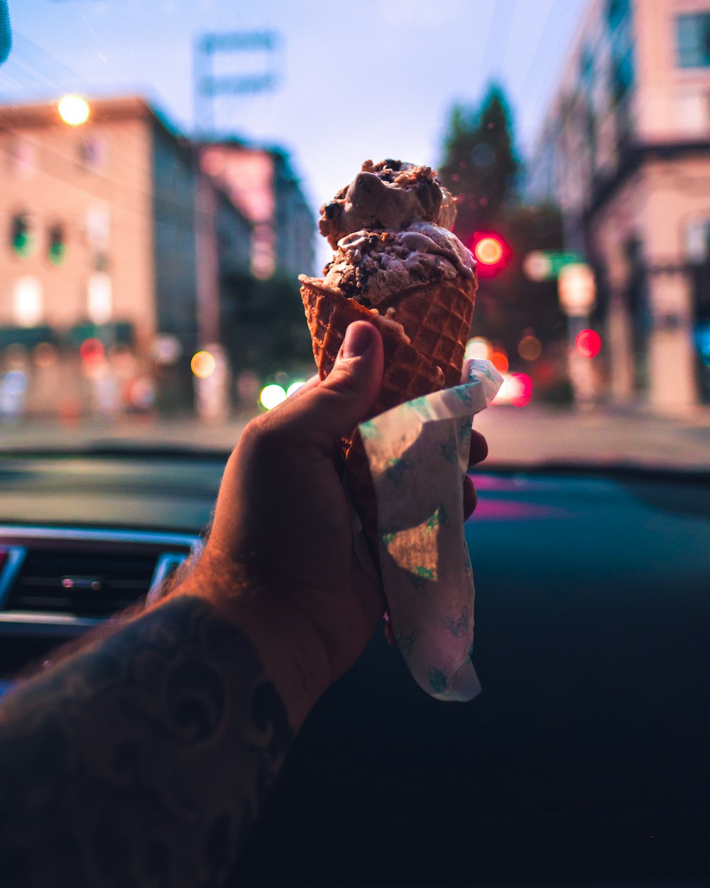 person holding ice cream cone