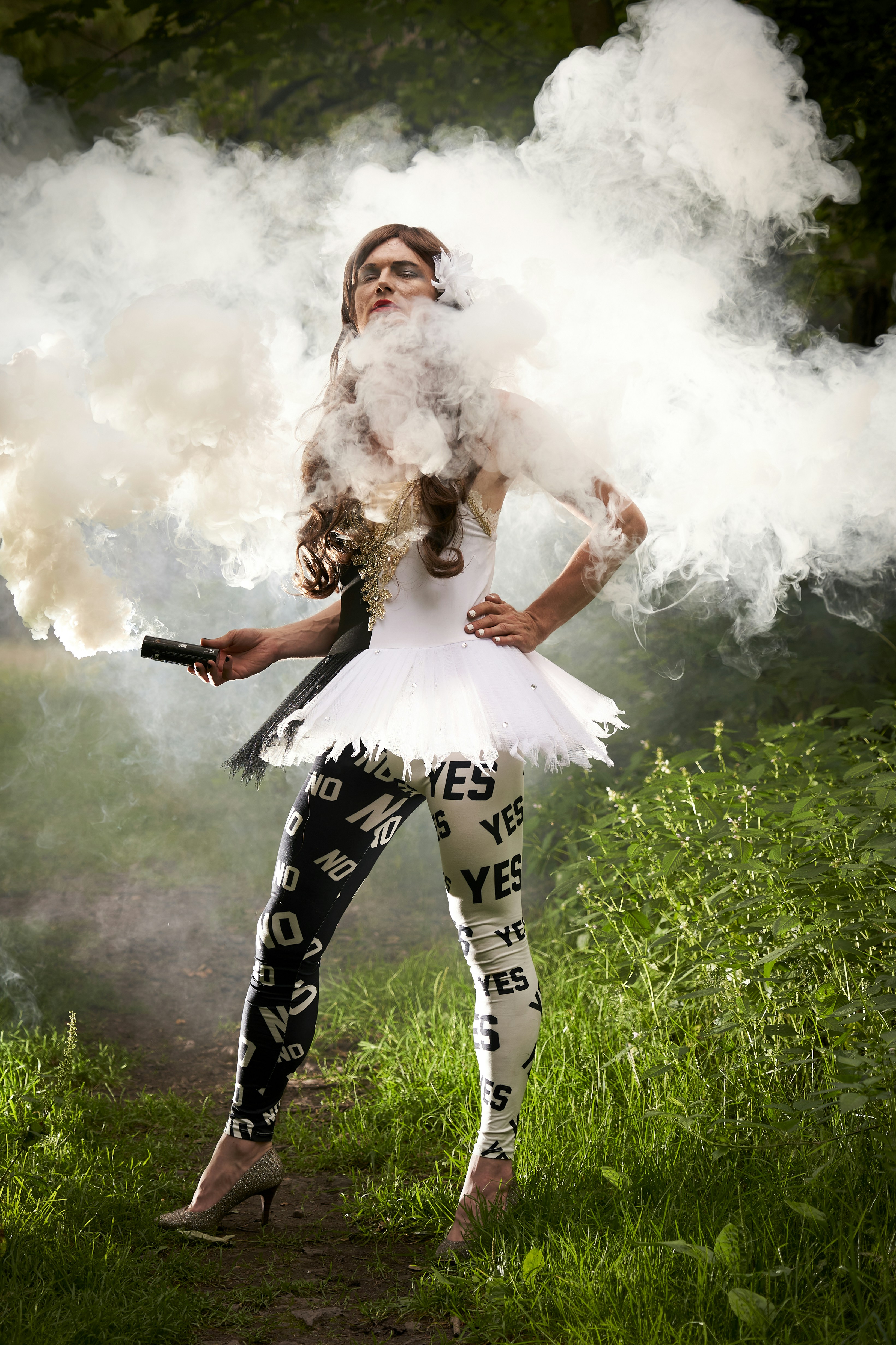 woman in white dress standing on green grass field