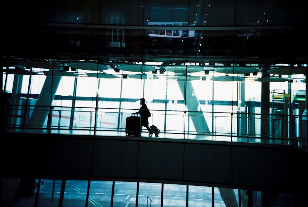 man in black jacket sitting on black chair